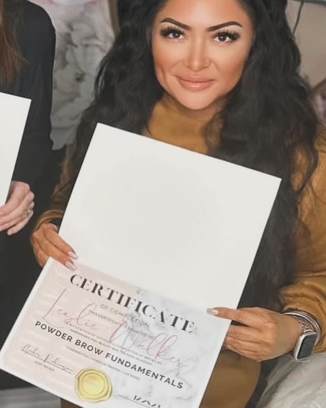 lady holding a certificate
